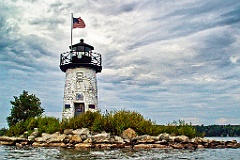 Ladies Delight Light with Flag Waving Under Clouds  - Gritty Loo